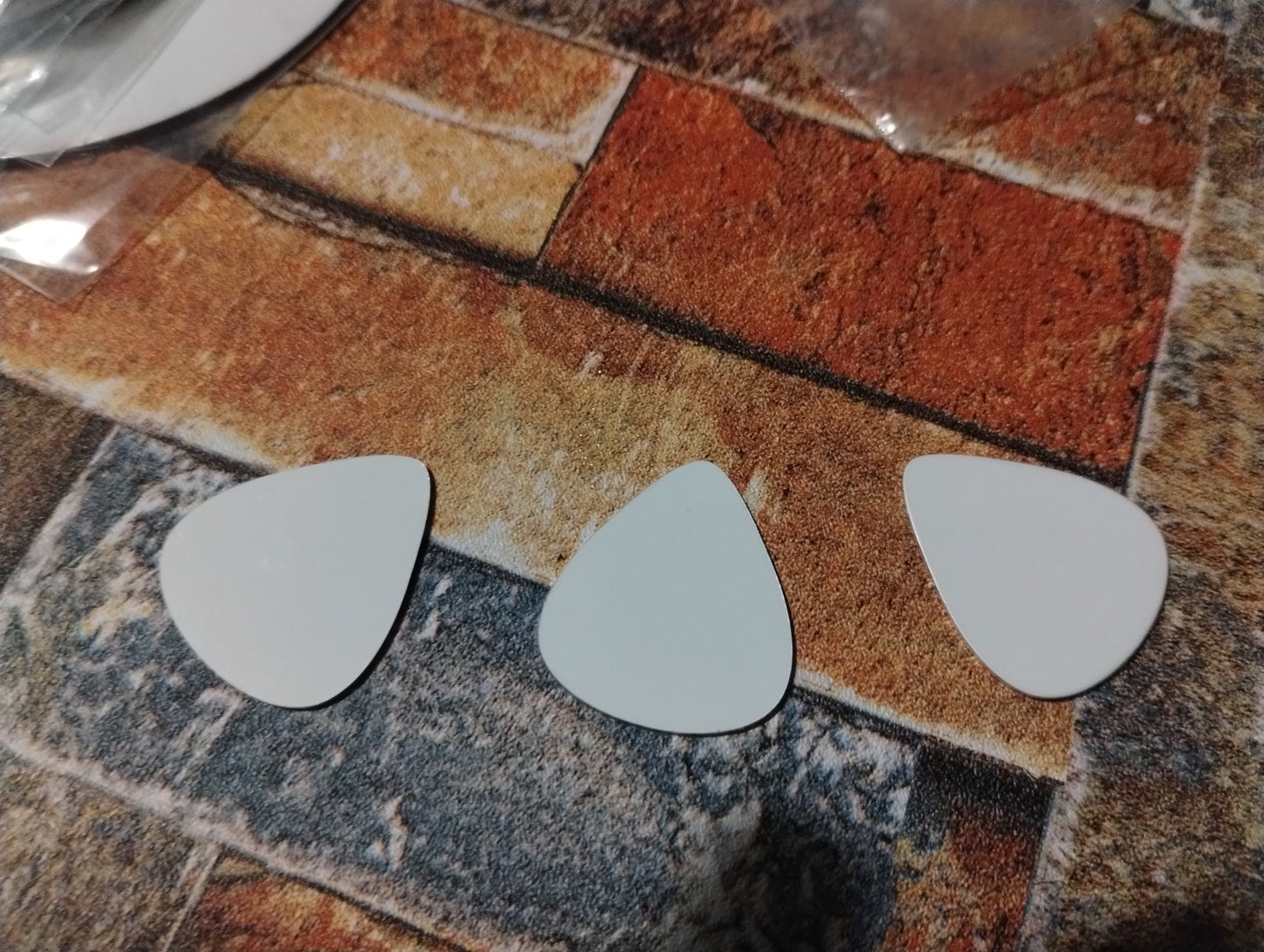 Guitar pick trio